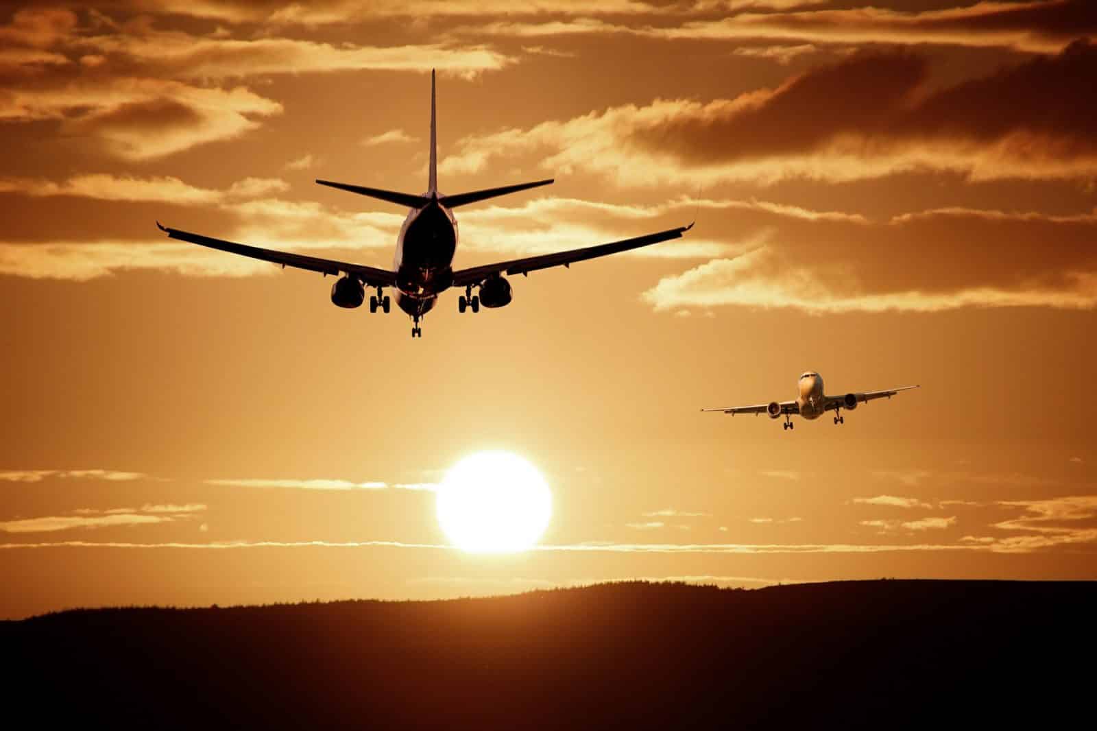airplanes taking off into sunset is your baggage mishandled