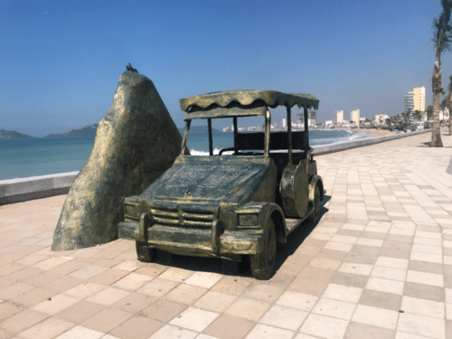 The Pulmonia Monument, a vibrant symbol of Mazatlán's iconic pulmonia taxis, stands proudly along the beachfront Malecon. This artistic sculpture showcases the unique charm and cultural significance of these open-air taxis that navigate the city's streets. Adorned with colorful details, the Pulmonia Monument captures the spirit and energy of Mazatlán's transportation heritage.