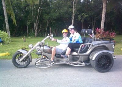 Man and woman ride on a trike motorcycle on tour in Cozumel with Trikes Cozumel