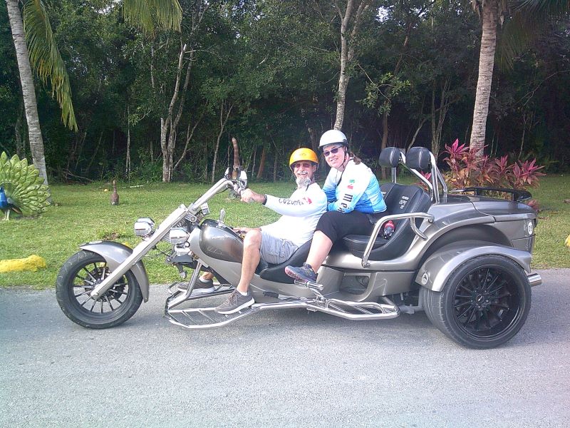 Man and woman ride on a trike motorcycle on tour in Cozumel with Trikes Cozumel