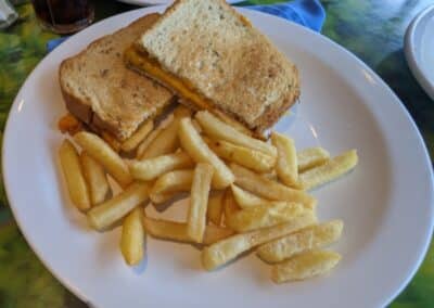 golden french fries with toasted cheese sandwich with ham from the Carnival Deli on Carnival Cruise