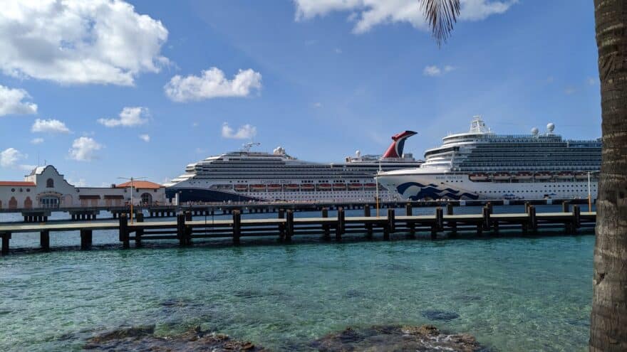 Carnival Glory cruising from New Orleans is anchored next to the Ruby Princess in Cozumel