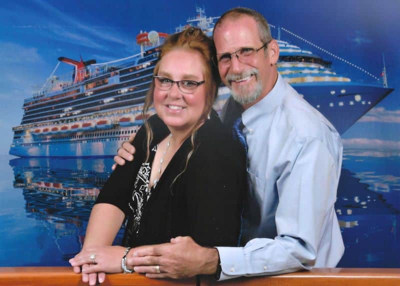 Your Gallivanting Souls, Mike & Kristina pose on elegant night in front of cruise ship backdrop