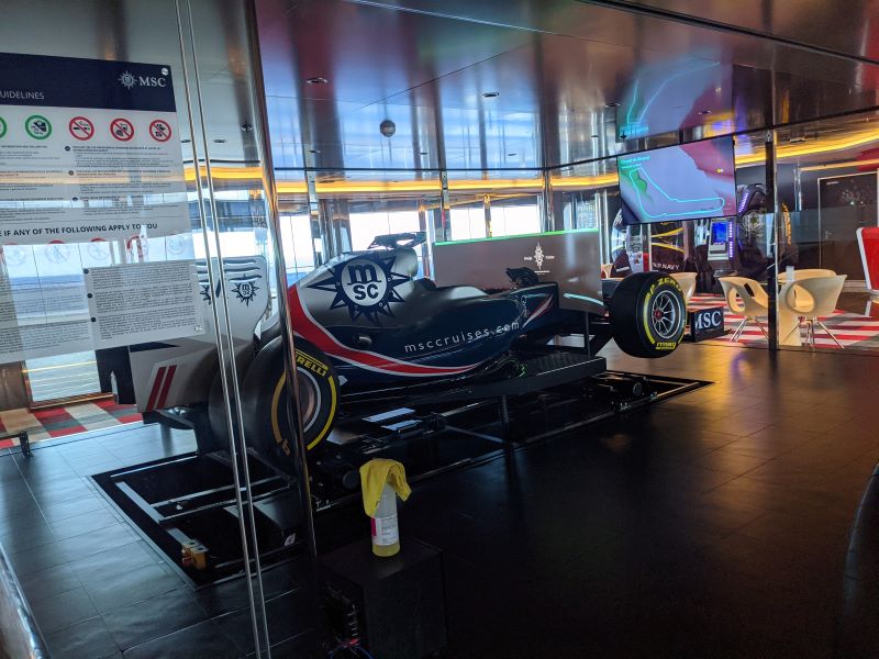 A race car sits inside one of the decks on MSC Meraviglia. This is actually a simulator race car that you can enjoy on your cruise.