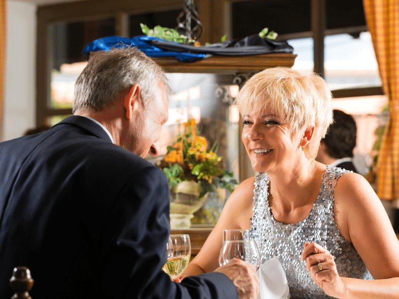 senior couple dines on elegant night on a cruise. Dressed to impress!