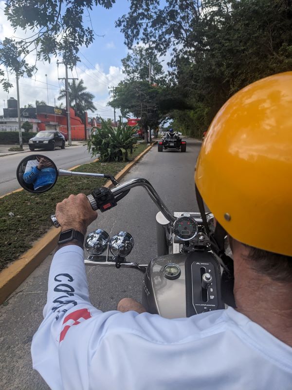 view from the back of a 3-wheeled trike in Cozumel.