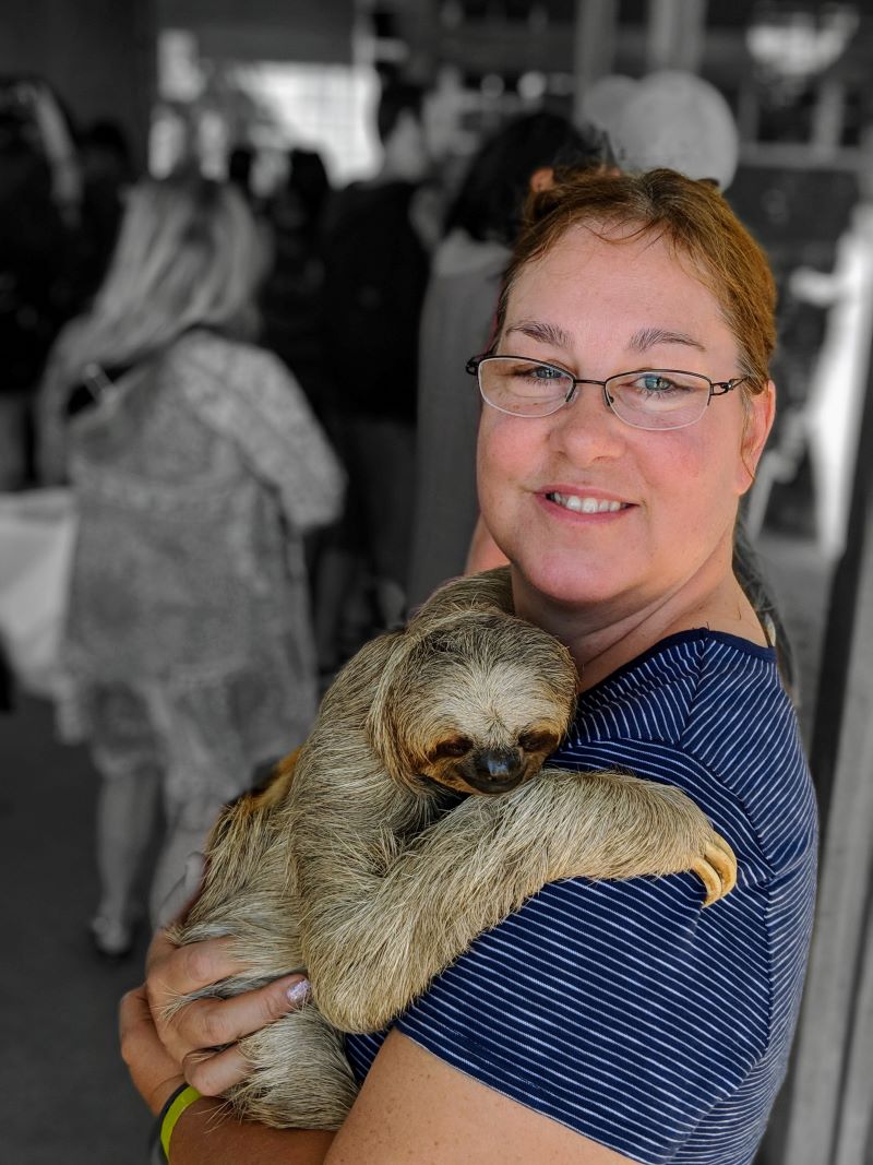 Holding a sloth in Roatan Experience