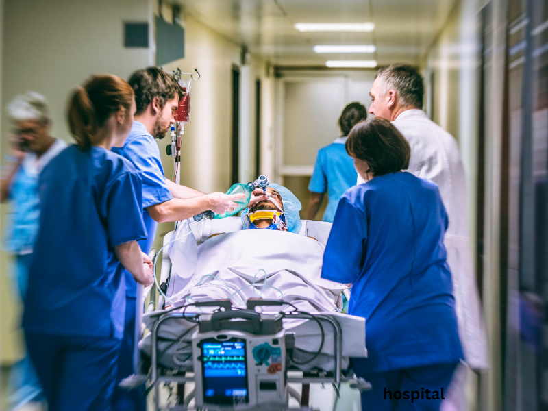 Patient receiving medical attention in a port emergency room after falling ill during a cruise stopover.