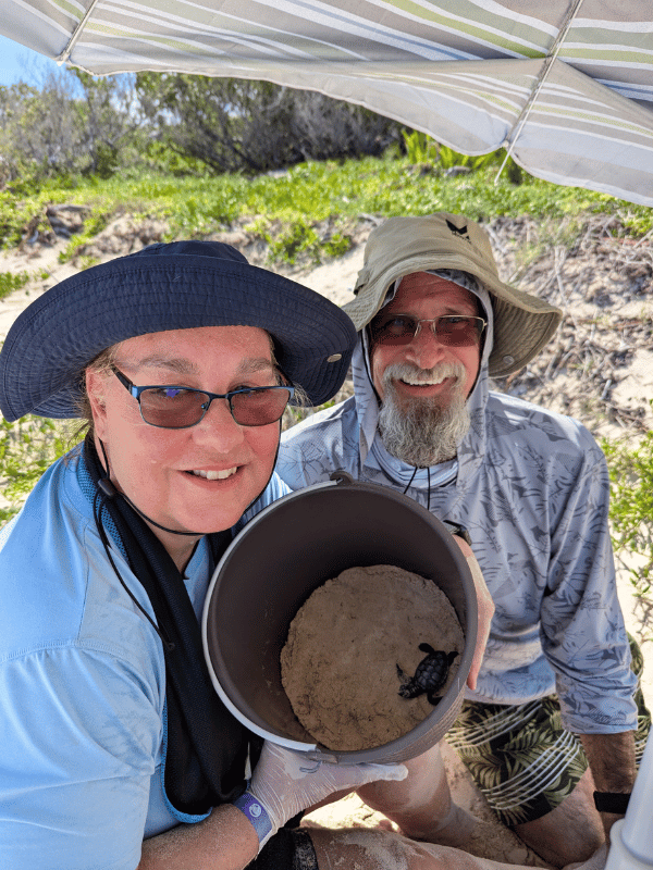 Man and woman with floppy hats