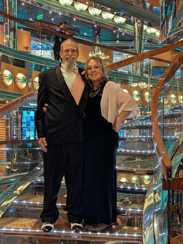 The Gallivanting Souls, Mike & Kristina pose at the staircase on Elegant Night.