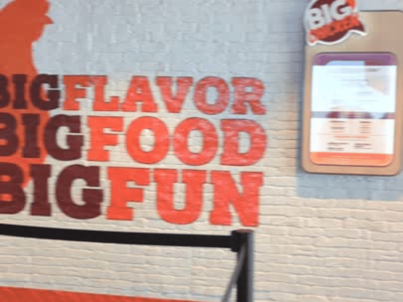 sign that says, "big flavor, big fun for Shaq's big chicken<br />