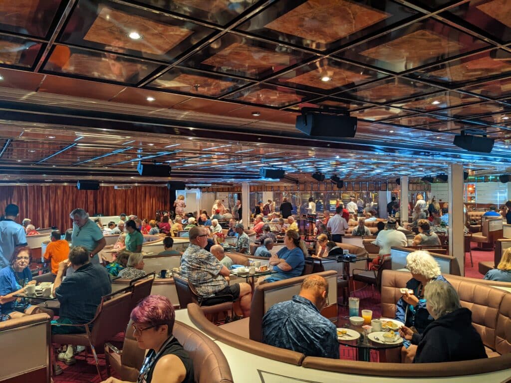 Some 600 guests enjoy a continental breakfast at the 4th For Fun's Sake Cruise with John Heald on Carnival Freedom